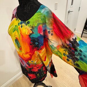 Art to wear! Soft, flowing, colorful floral tunic with asymmetrical hem